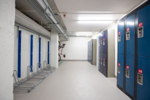 The bike room at Bayview Yards is shown, with bike racks and lockers visible. 