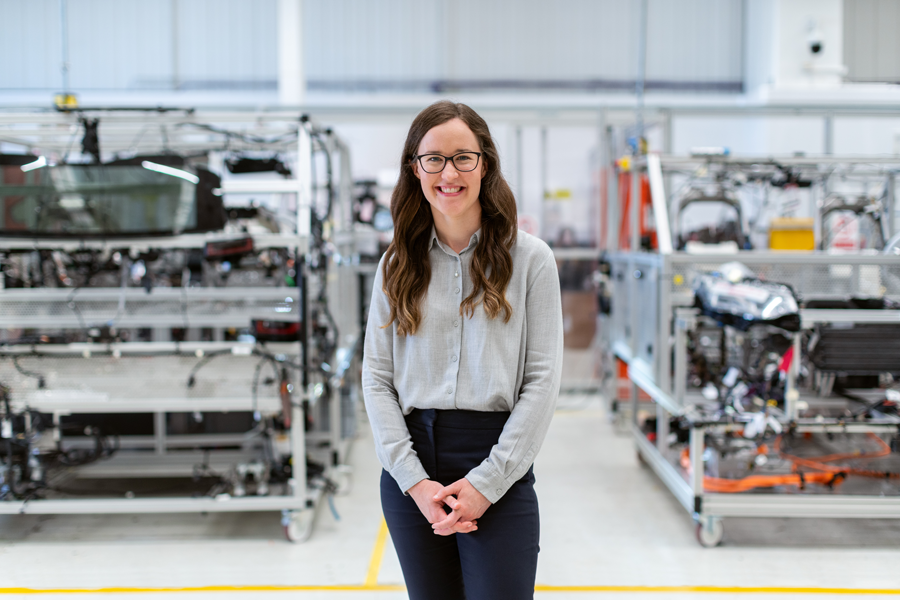 Woman smiling while standing in a lab